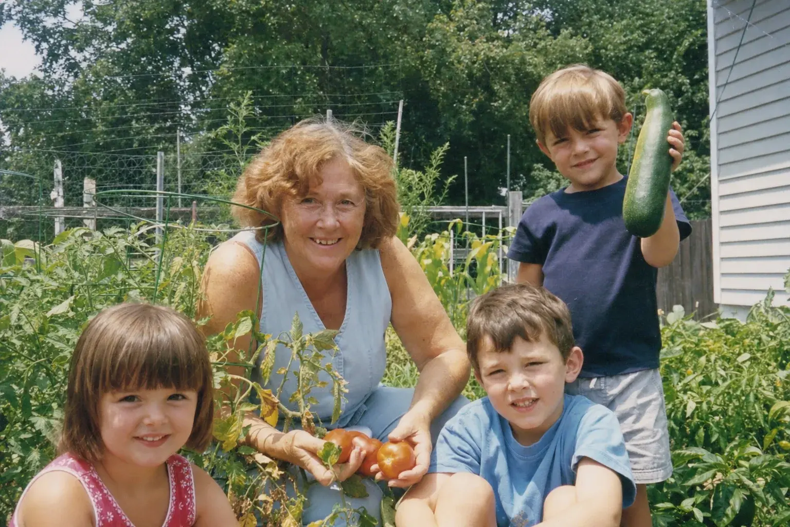 Peggy with her grandchildren in the garden, 2012